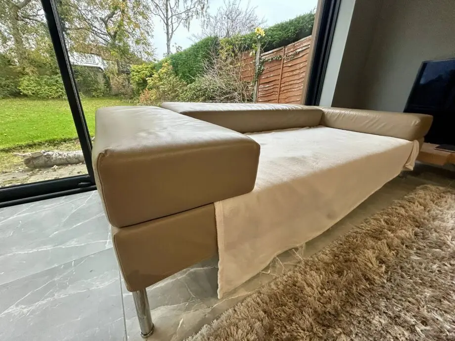 2 Seater modern reclining back sofa - Need re upholstering