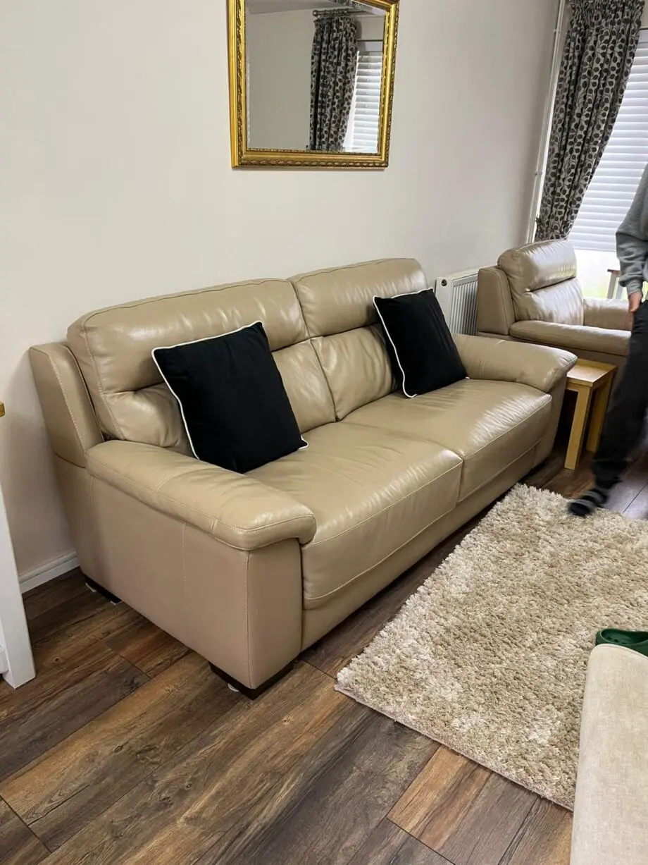 Beige 2 seater sofa with armchair and footstool