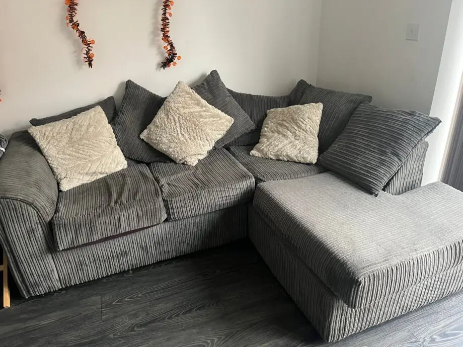 Grey corner sofa and cuddle chair with stool