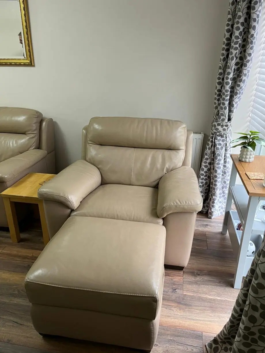 Beige 2 seater sofa with armchair and footstool