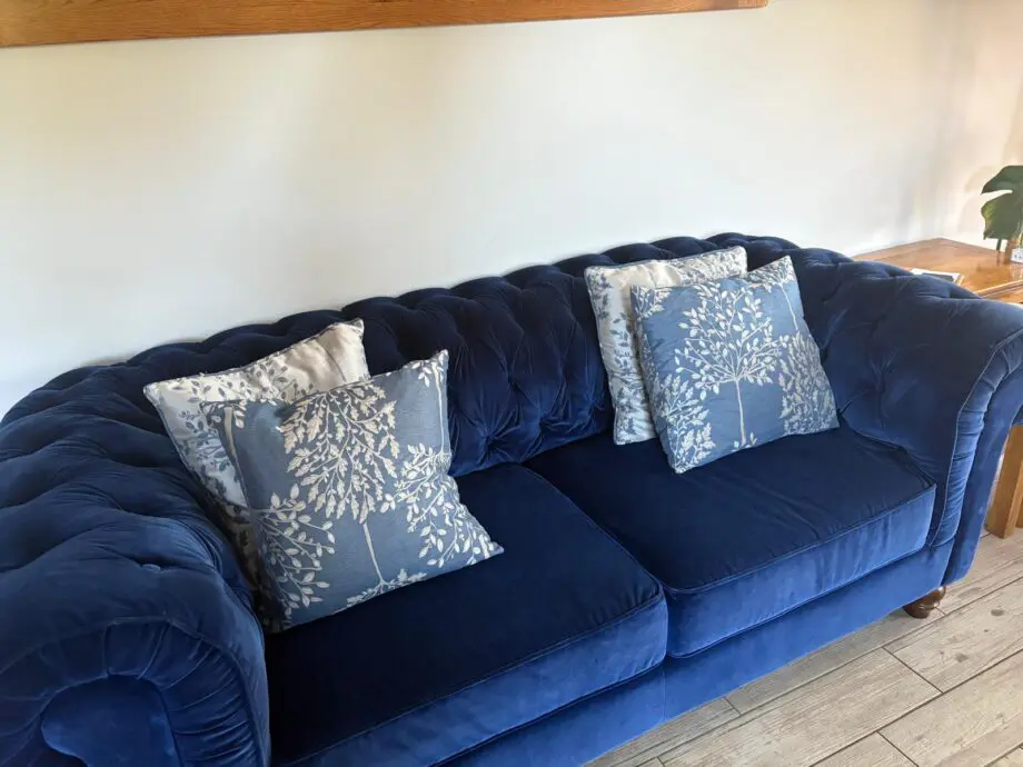 2 x Navy Velvet Chesterfield Sofas & Footstall excellent condition