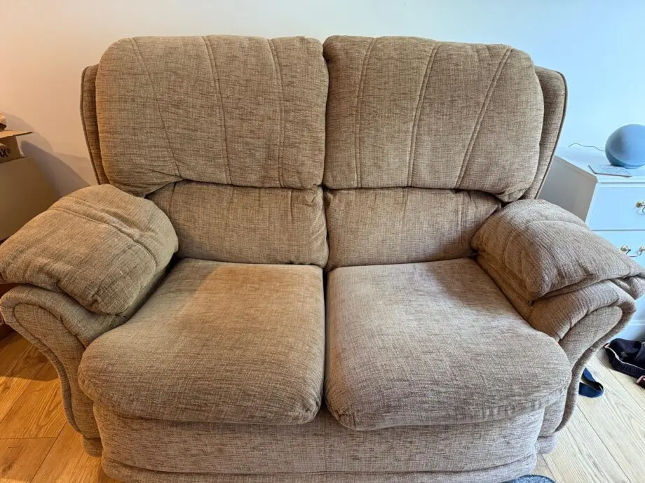 Beige two seater sofa