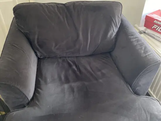 Dark blue (nearer to black) sofa and arm chair