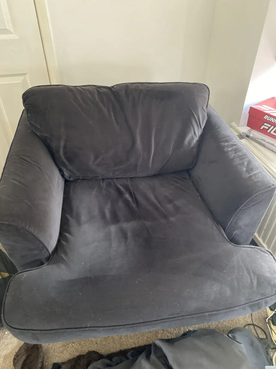 Dark blue (nearer to black) sofa and arm chair