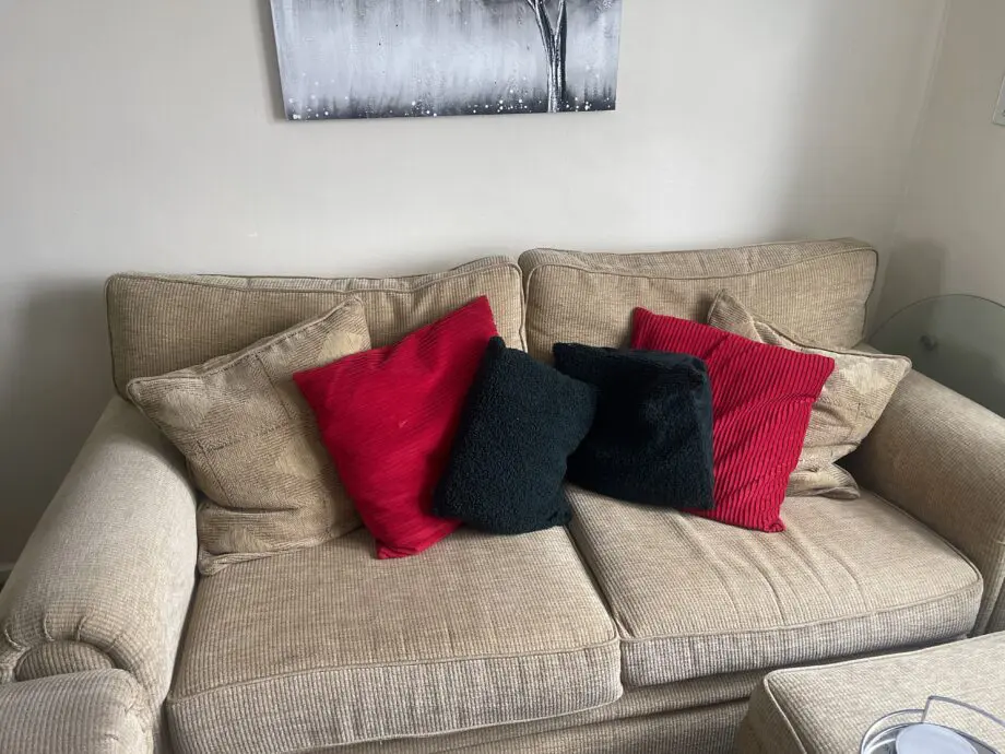 Beige sofa and pouffe
