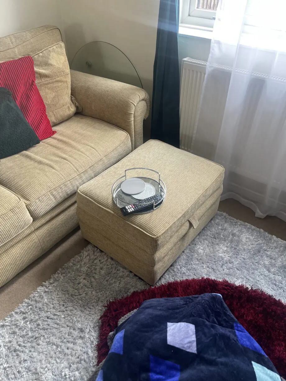 Beige sofa and pouffe