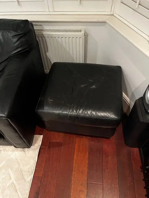 A set of 2 Black Leather sofa's