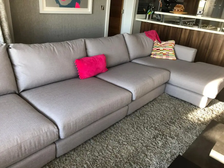 Extra large grey corner sofa with footstool and storage