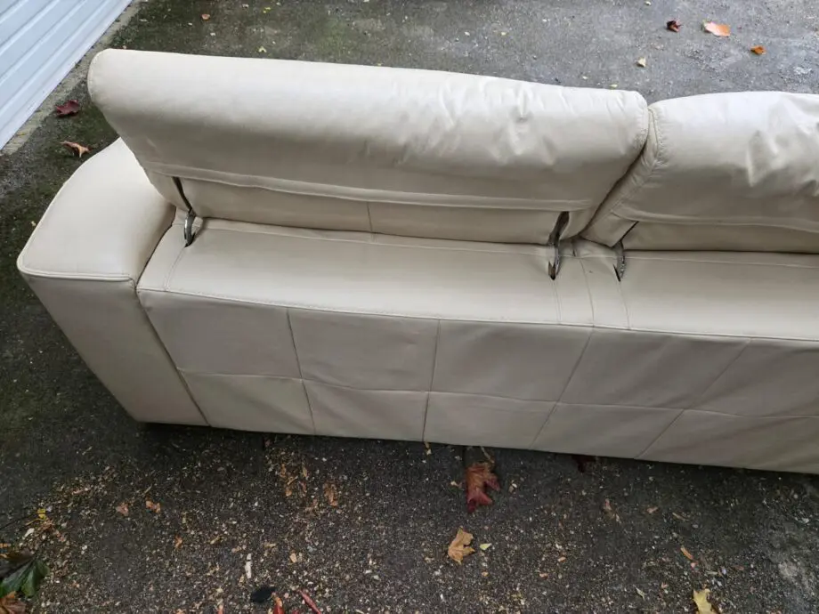 Good quality two seater creme leather sofabed