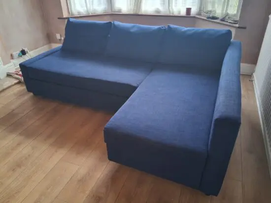 Corner sofa-bed with storage, blue