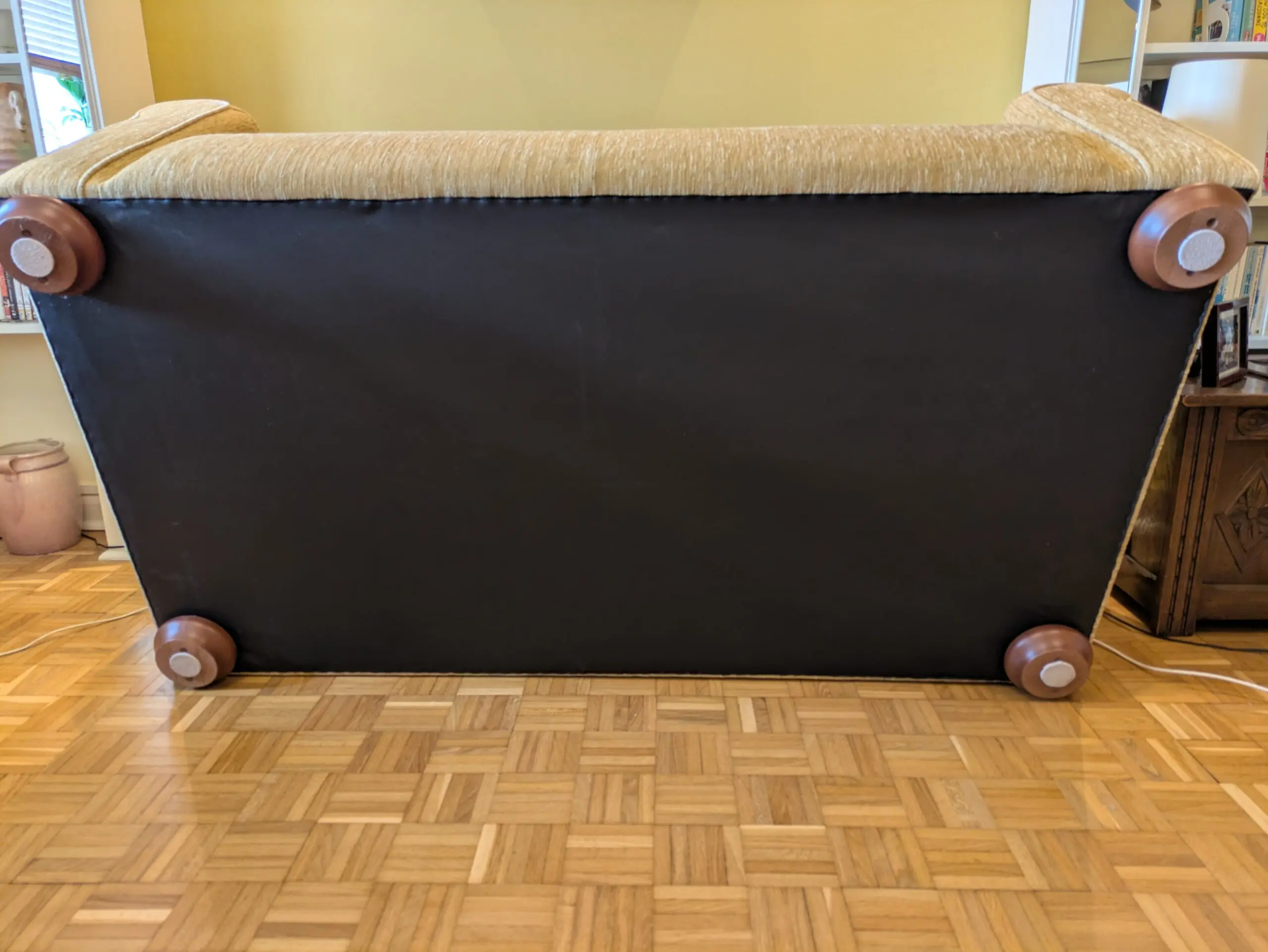 Two identical Parker Knoll sofas in soft gold chenille fabric.