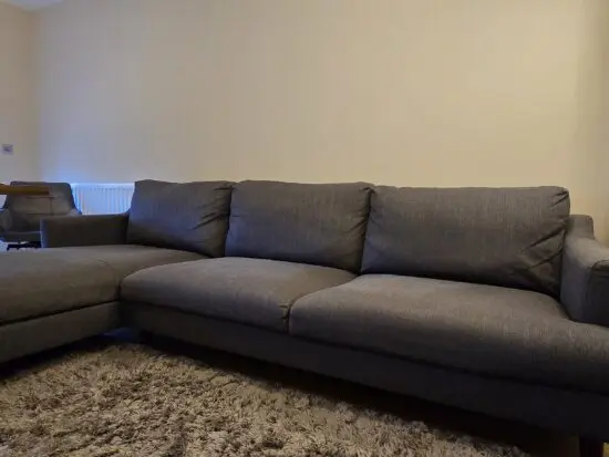 Left-handed three-seater sofa from Furniture and Choice, gray woven fabric, in very good shape.