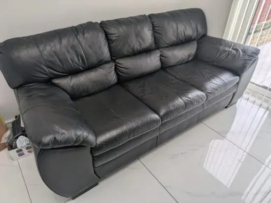 DFS black leather sofa cost £1000