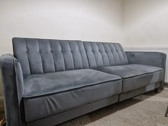 Beautiful and comfortable grey coloured 4-seater sofa bed