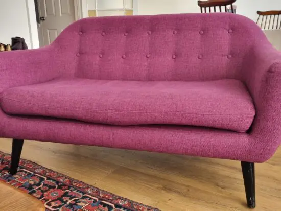 Purple tufted two-seater sofa