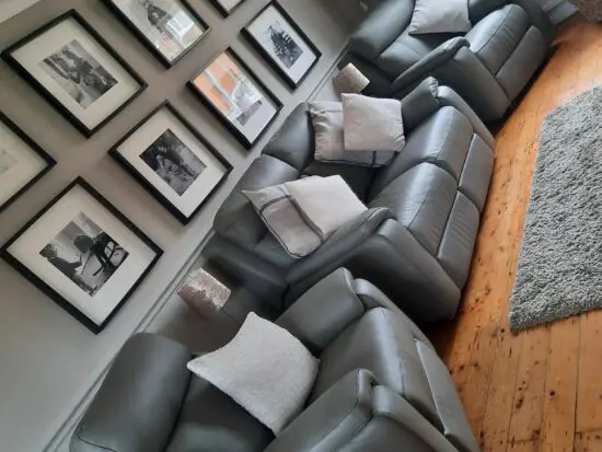 Poltronesofa grey Italian leather two seater sofa and two power recliner chairs