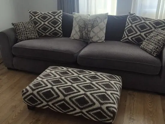 4 seater Sofa and footstall