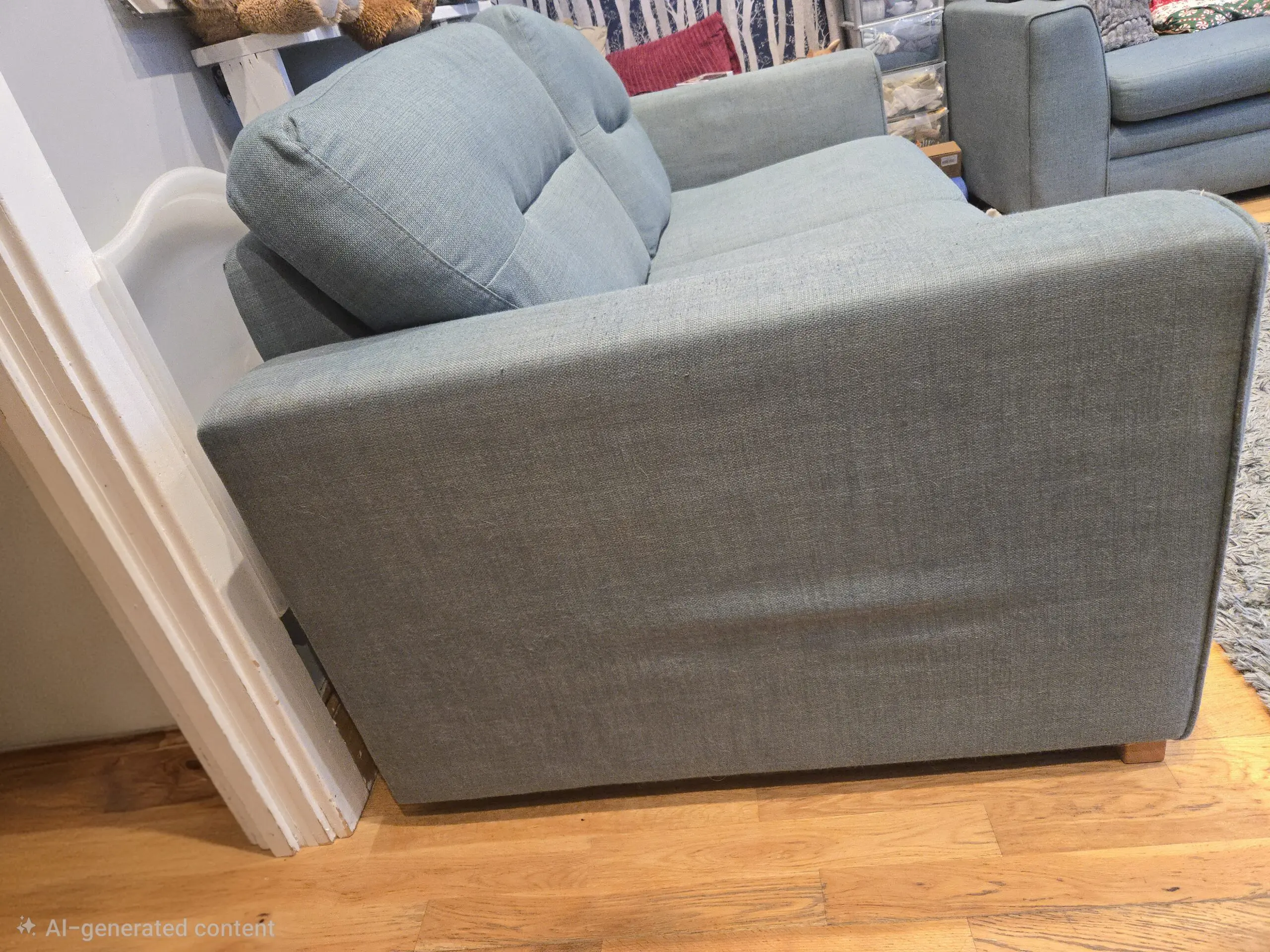 large 3 and 2 seater sofas in a light teal/blue colour
