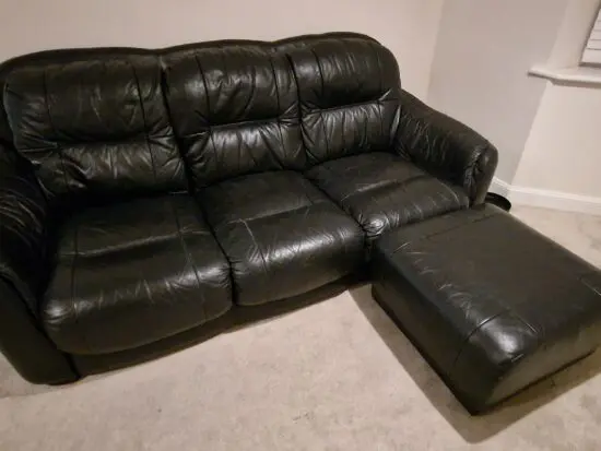 Genuine leather, 4 seater black sofa with pouffe