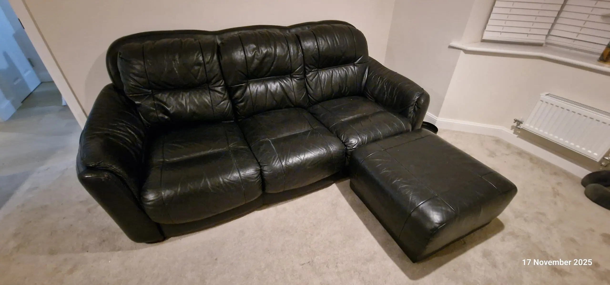 Genuine leather, 4 seater black sofa with pouffe