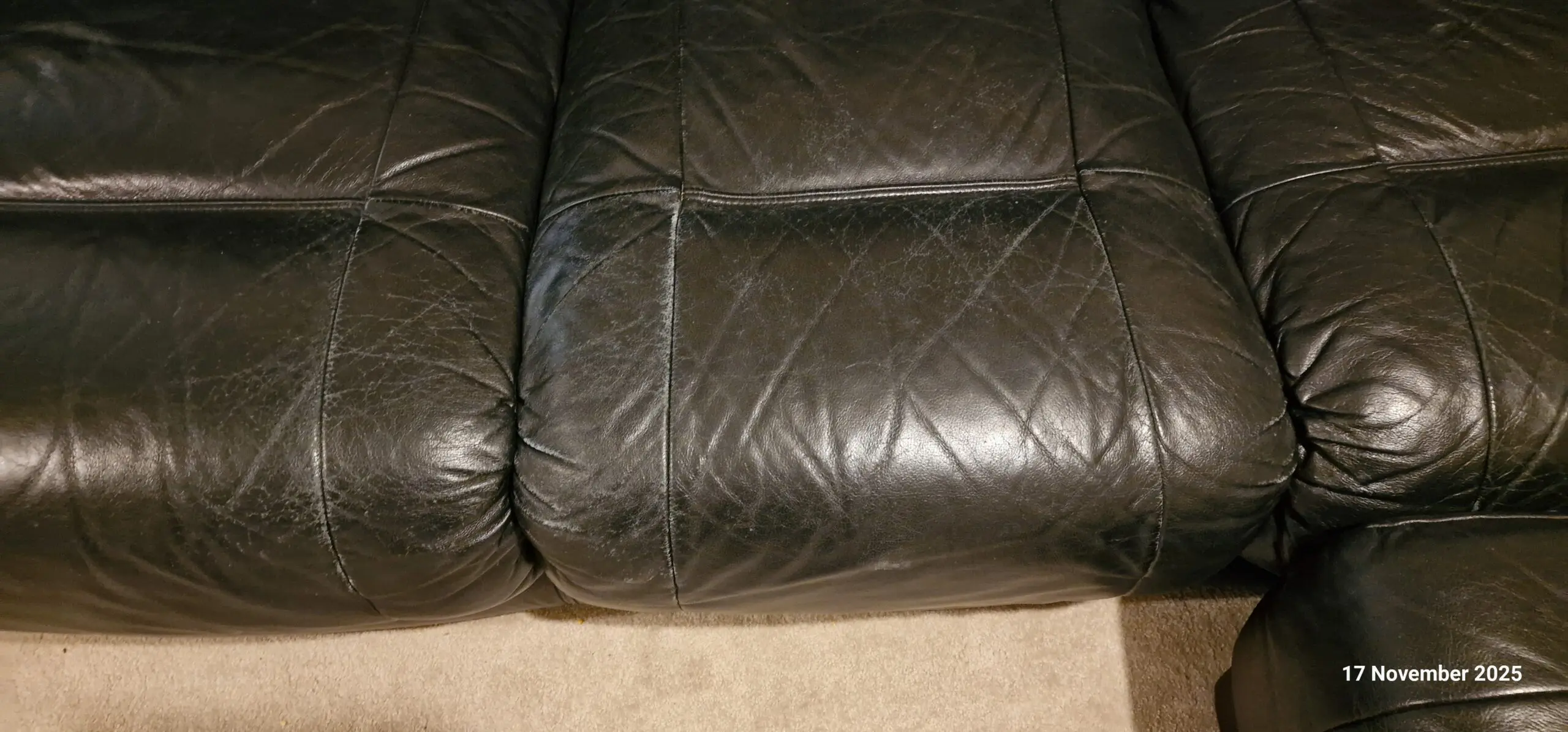 Genuine leather, 4 seater black sofa with pouffe