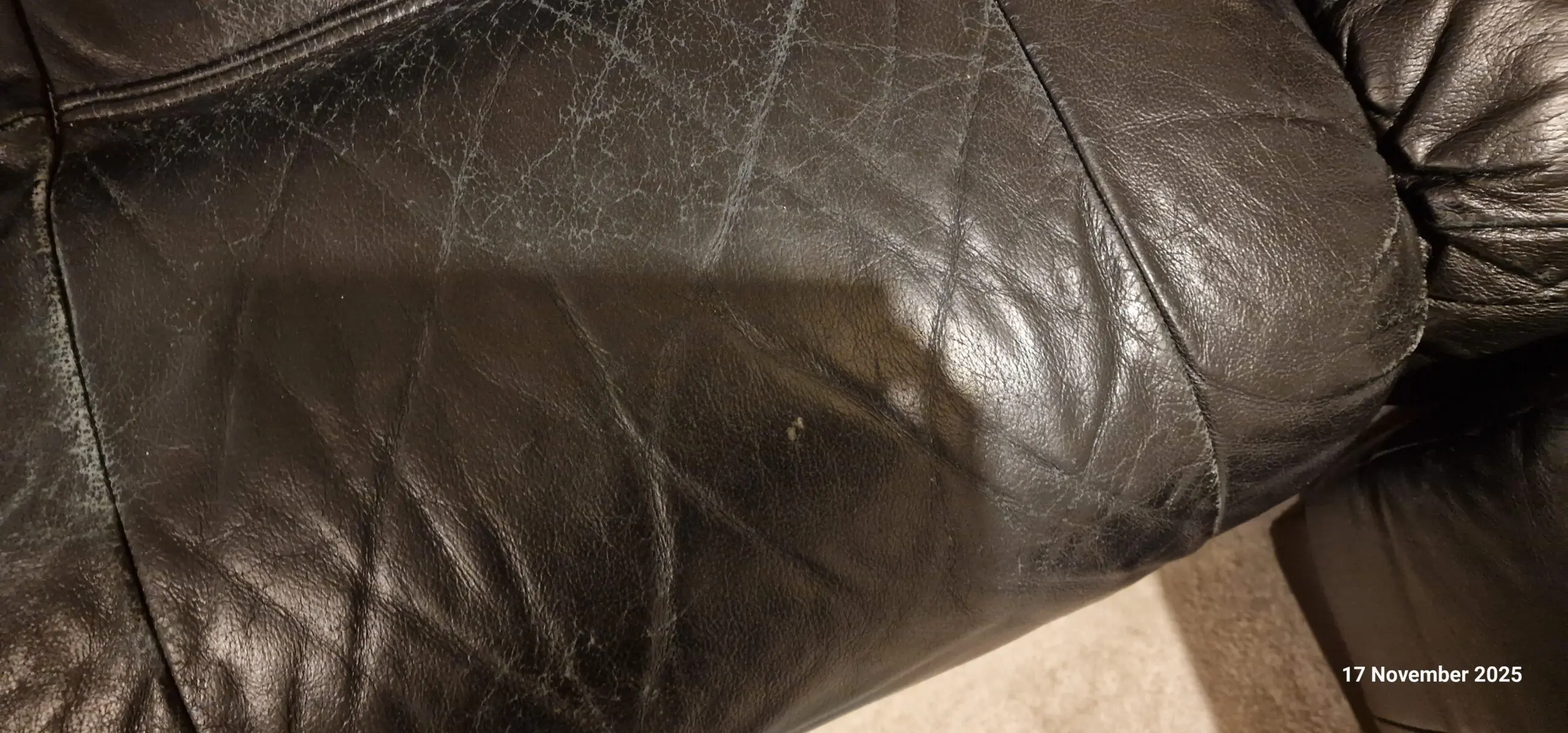 Genuine leather, 4 seater black sofa with pouffe