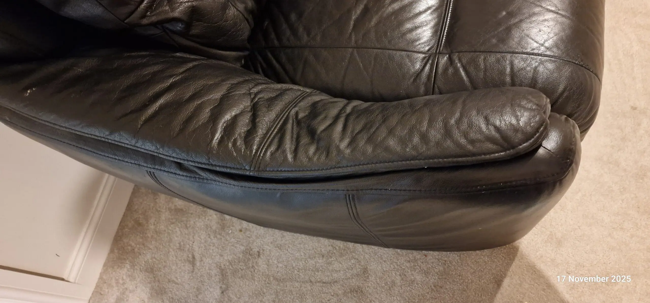 Genuine leather, 4 seater black sofa with pouffe