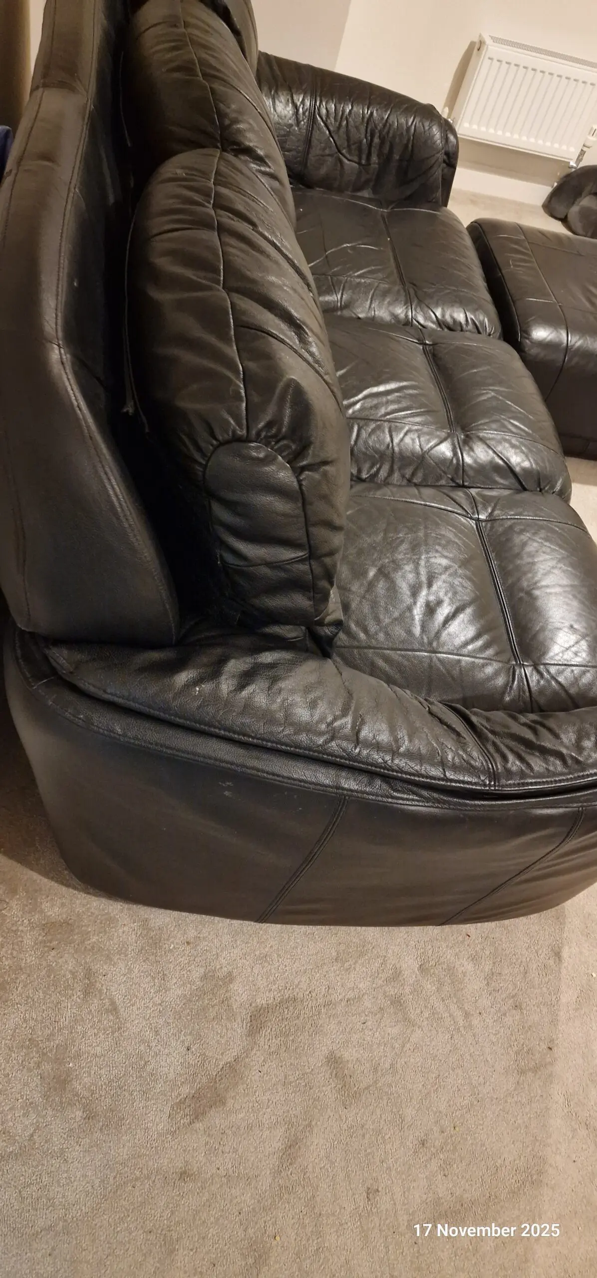 Genuine leather, 4 seater black sofa with pouffe
