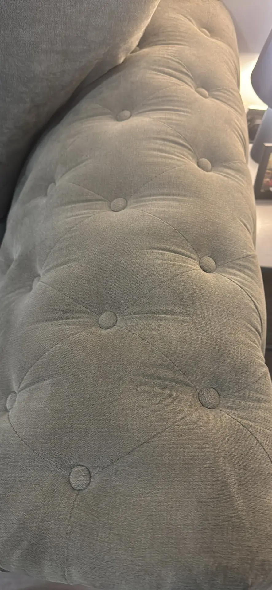 Large grey 4 seater tufted sofa and foot stool