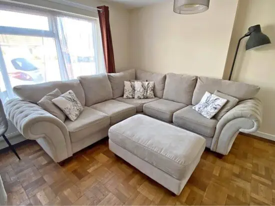 DFS Cream Nicole 4 seater corner sofa with footstool