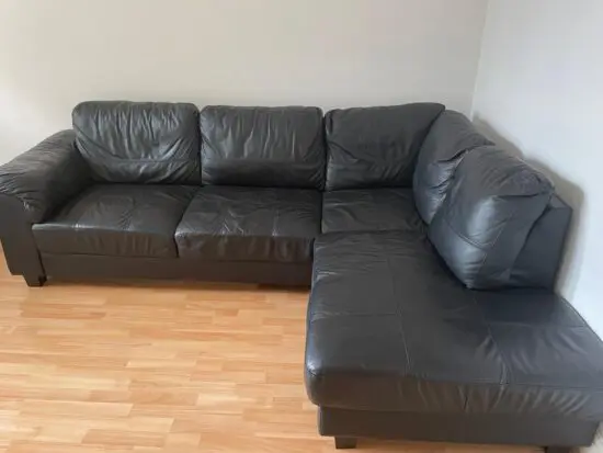 Black leather L shaped sofa