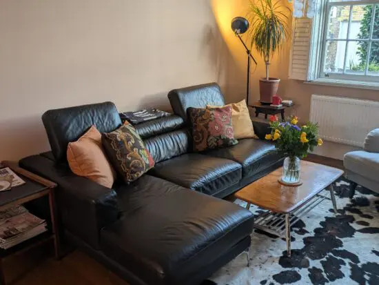 Mid-century timeless Italian black leather sofa with chrome legs