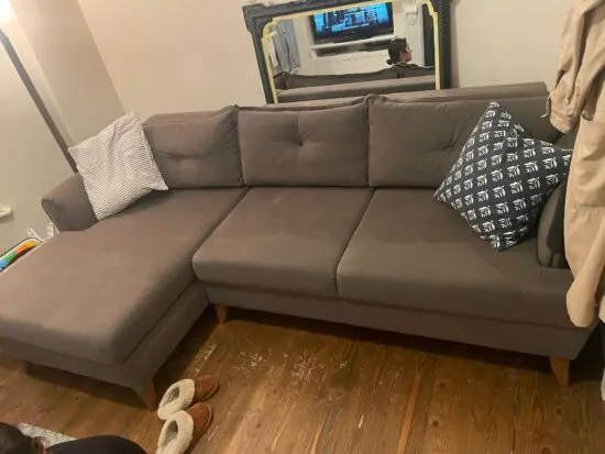 Grey L shaped sofa-bed