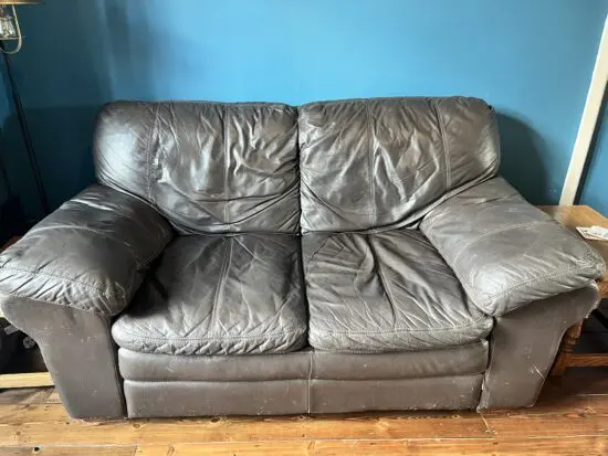 Black leather 2 seater sofa