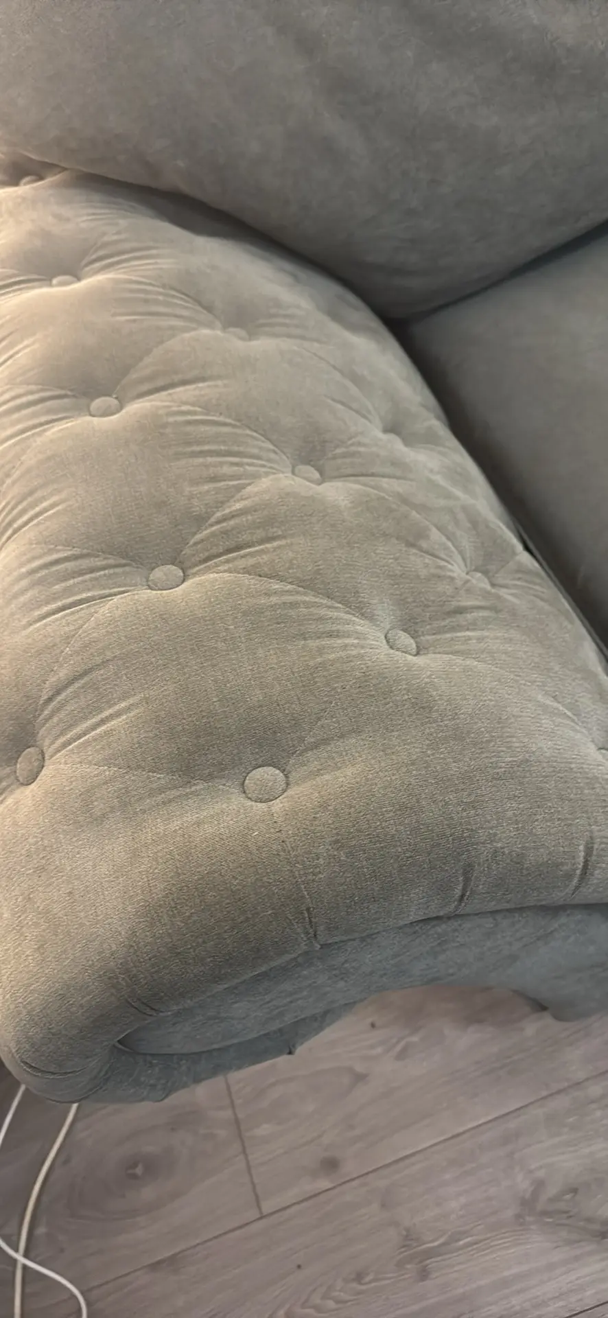 Large grey 4 seater tufted sofa and foot stool