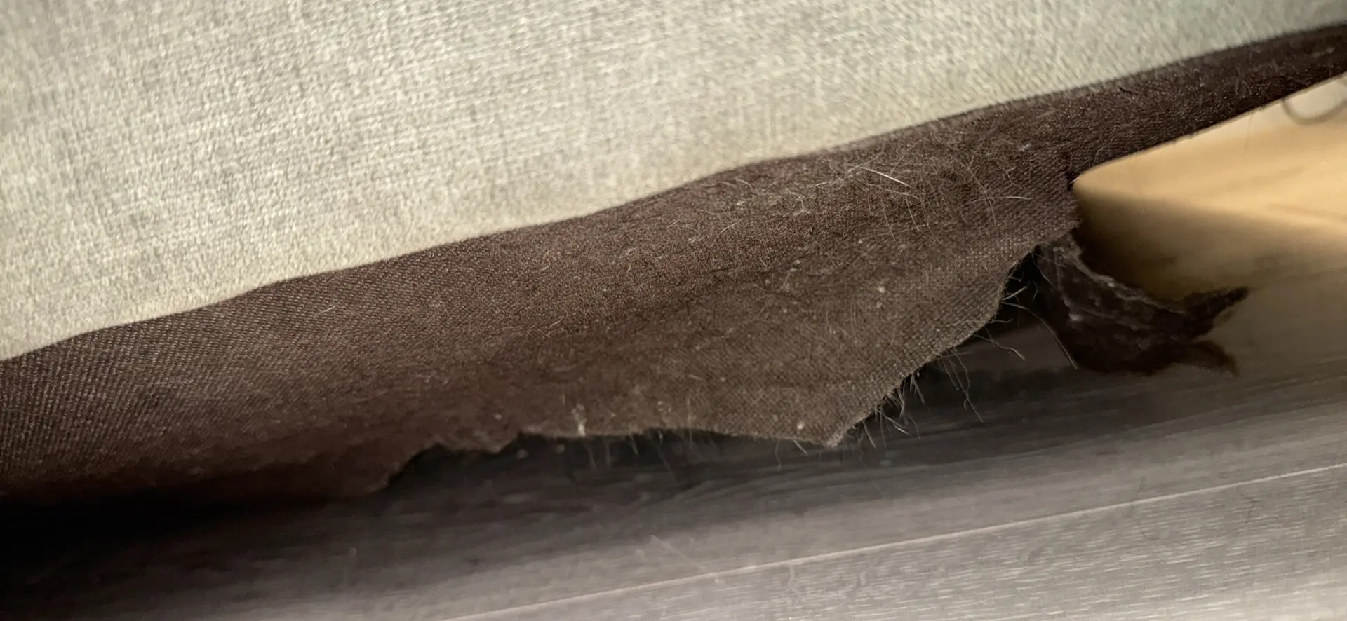 Large grey 4 seater tufted sofa and foot stool