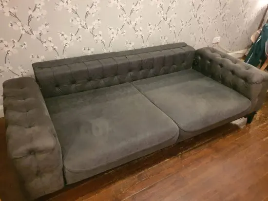 Dark grey suede Chesterfield sofabed
