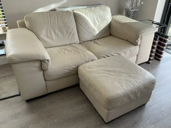 Natuzzi 2 seater cream sofa.