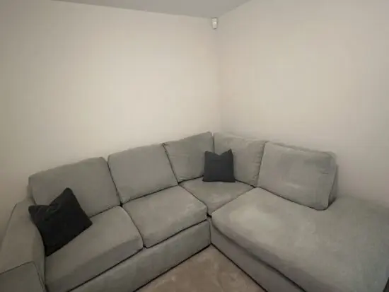 Grey L corner sofa with swivel chair and foot stall