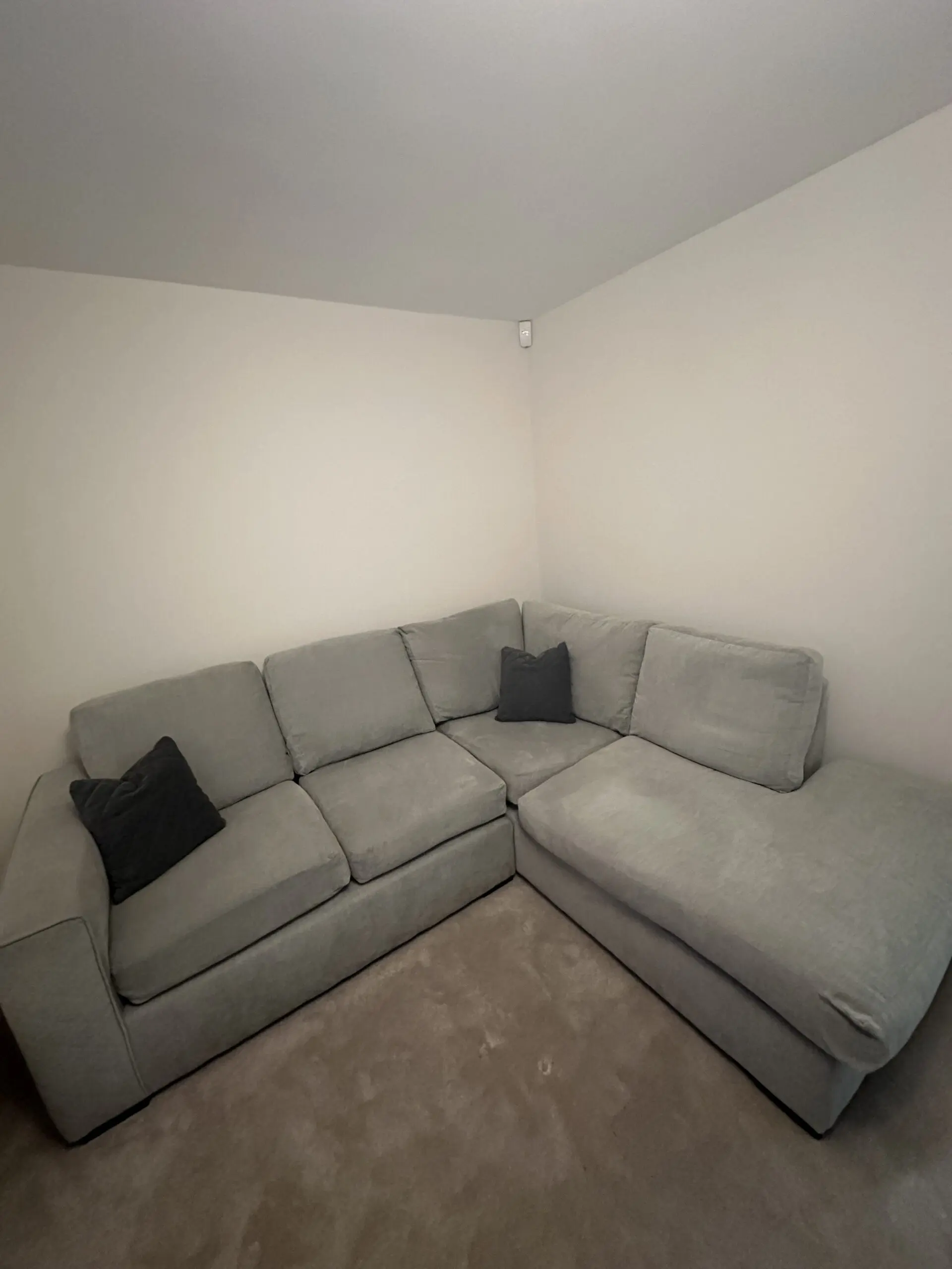 Grey L corner sofa with swivel chair and foot stall