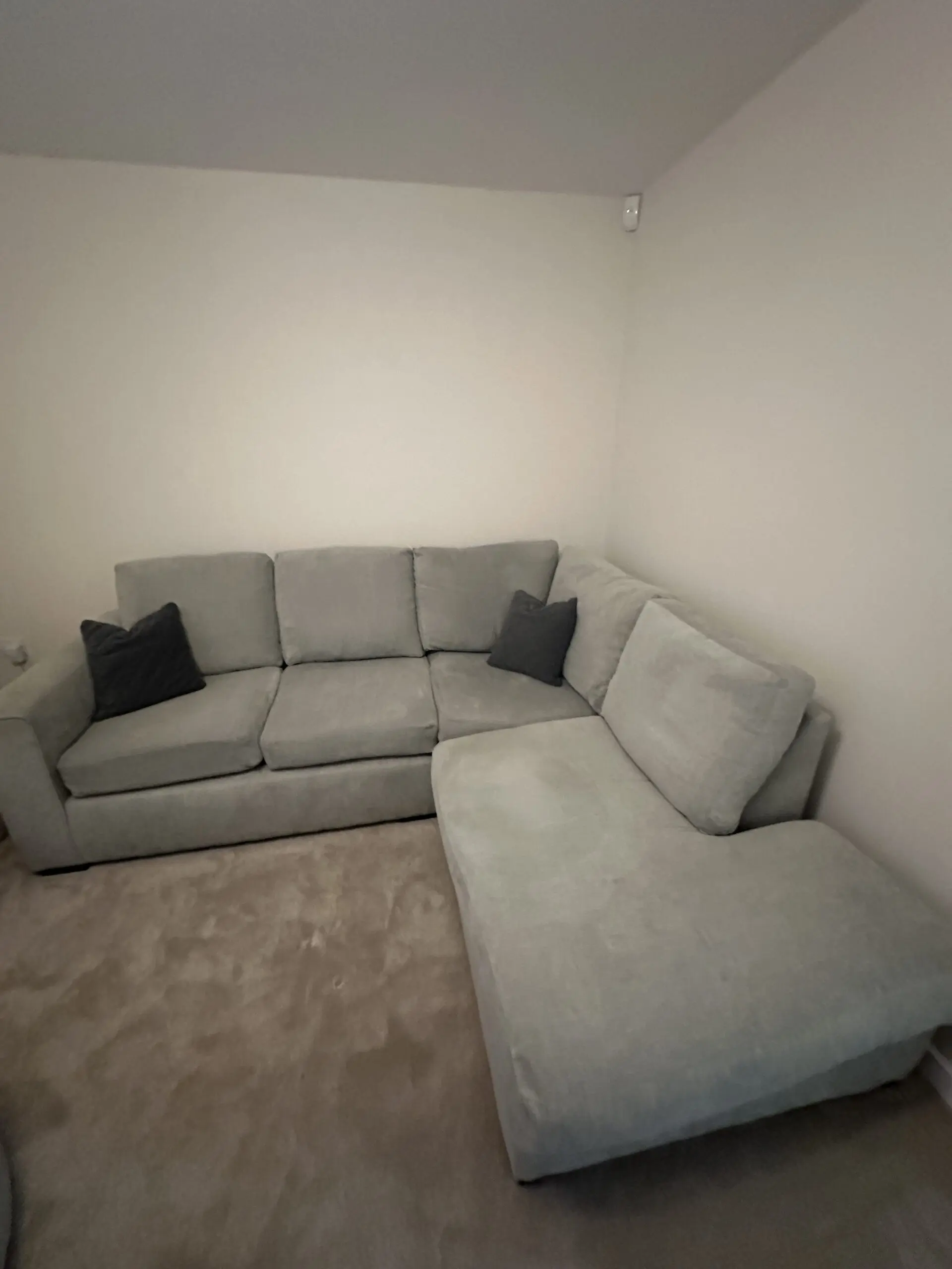 Grey L corner sofa with swivel chair and foot stall