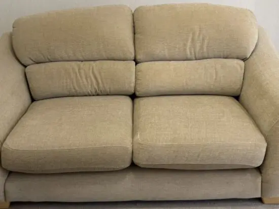 Beige 2 seater sofa