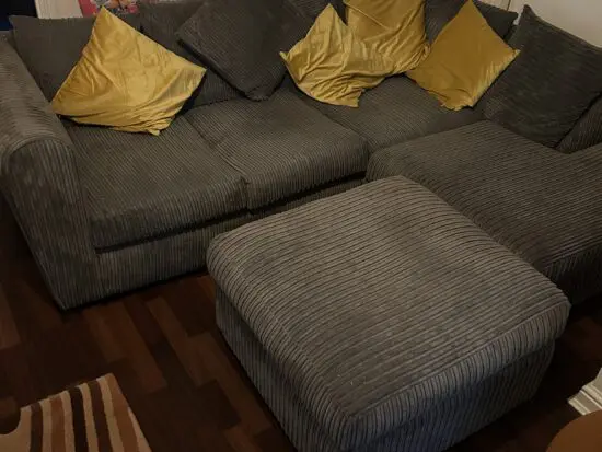 Grey corner sofa from Dunelm with footstool