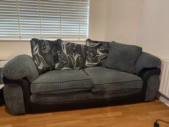Dark grey and black 2-3 seater sofa