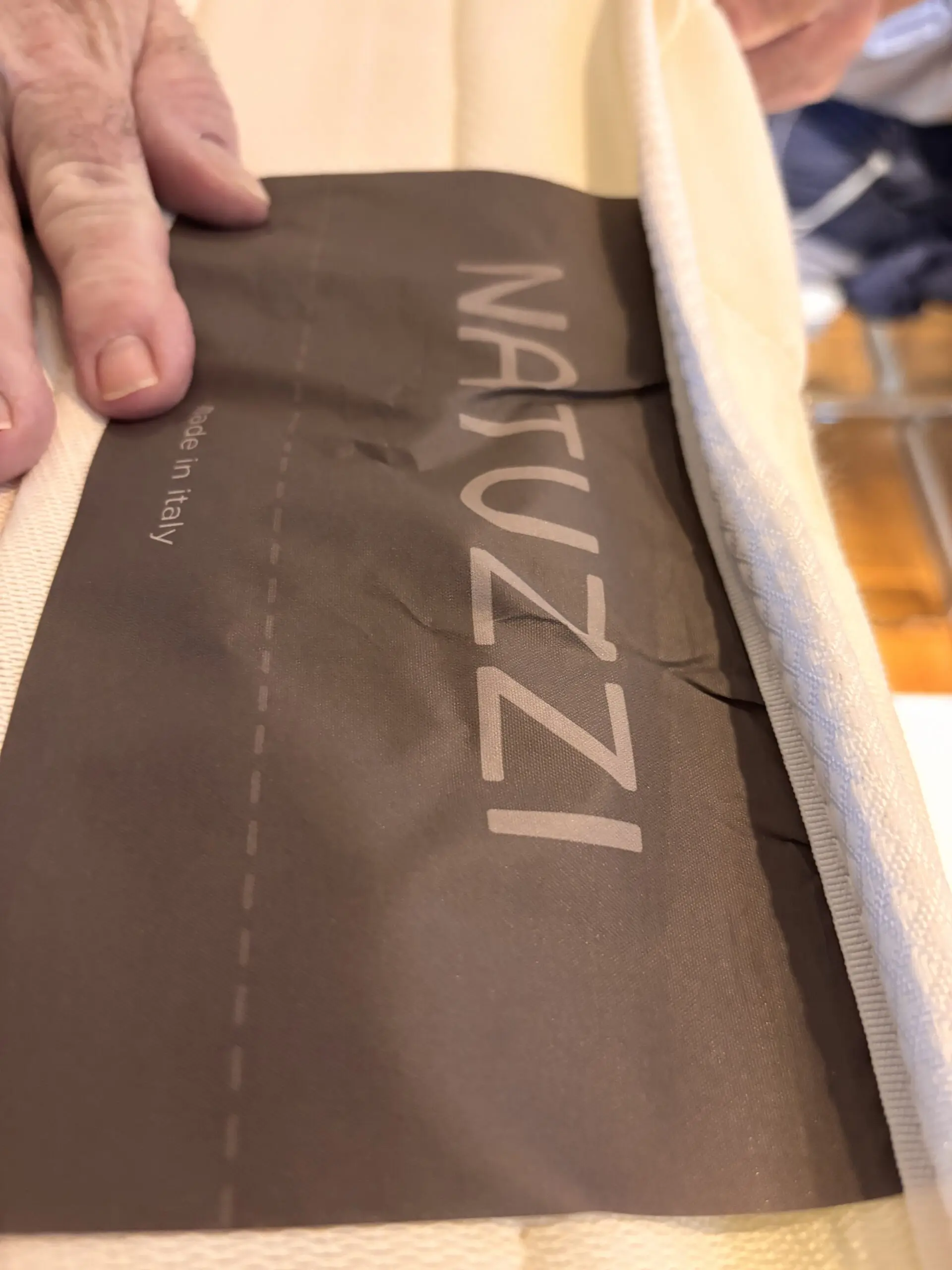 Grey leather Natuzzi 4 seater corner sofa bed, with storage chaise.