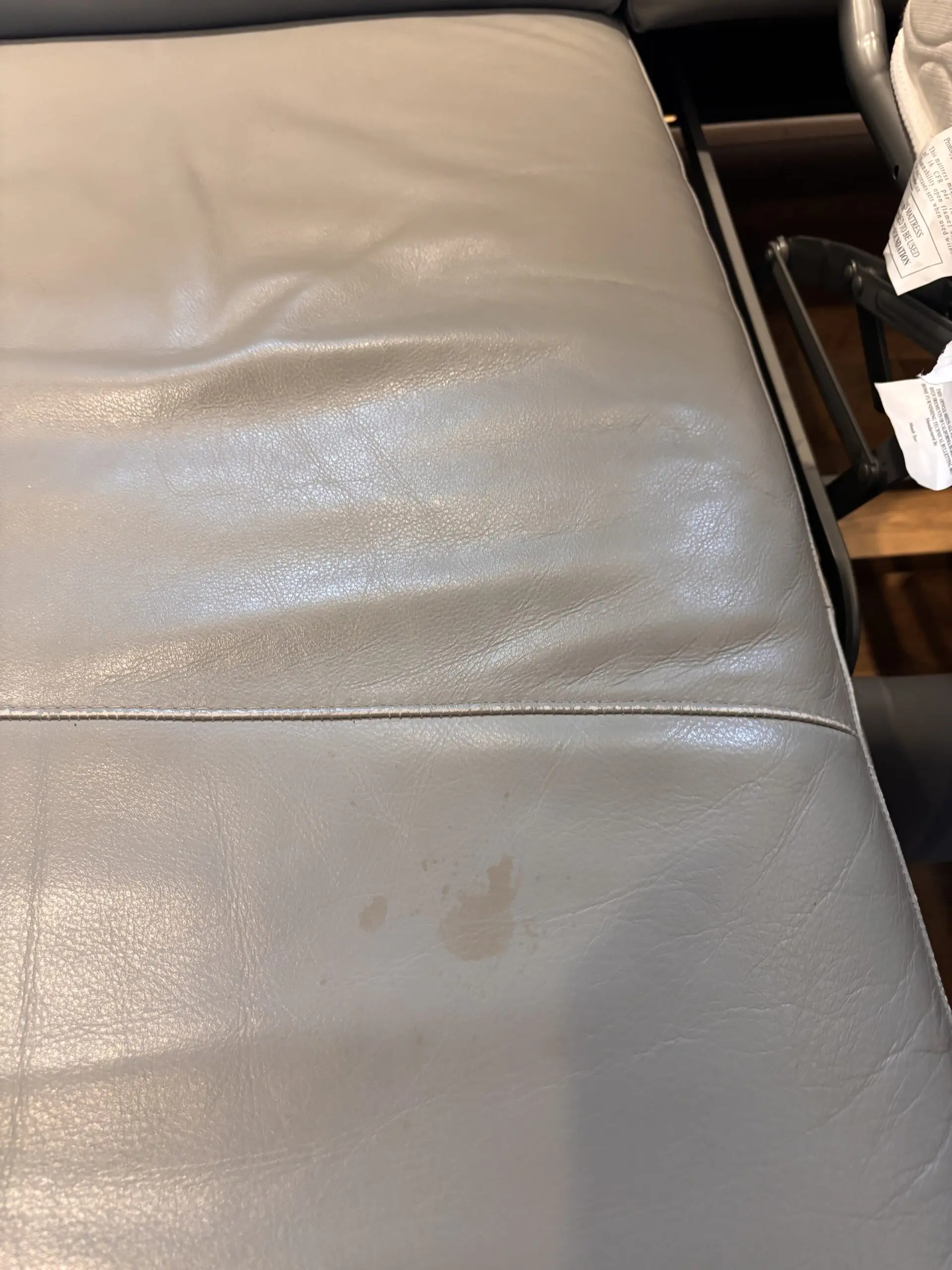 Grey leather Natuzzi 4 seater corner sofa bed, with storage chaise.