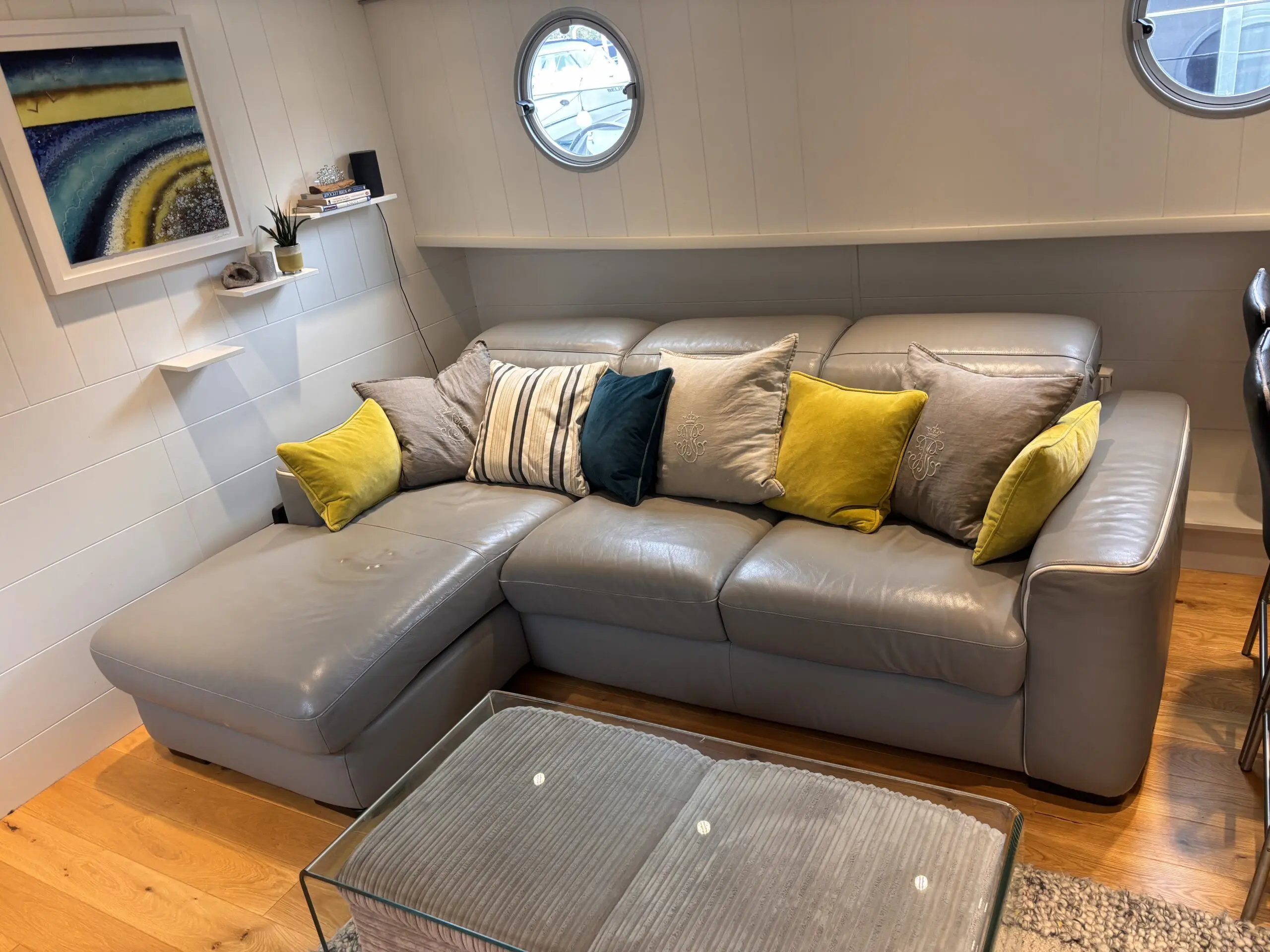 Grey leather Natuzzi 4 seater corner sofa bed, with storage chaise.