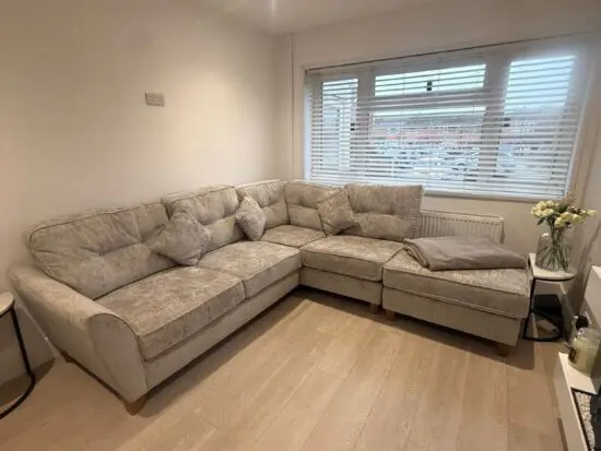 Grey corner sofa with foot stool