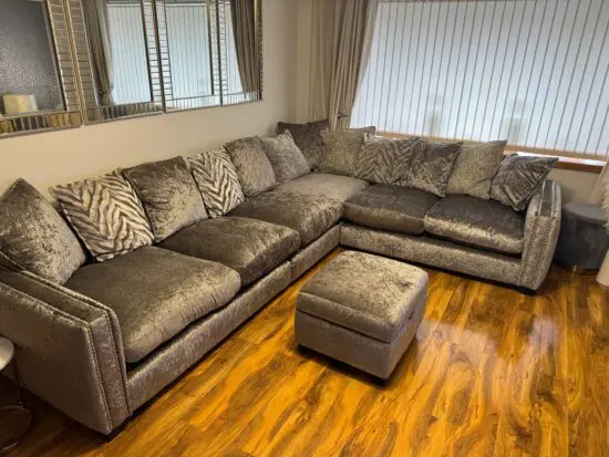 DFS silver grey crushed velvet corner sofa with scatter back cushions