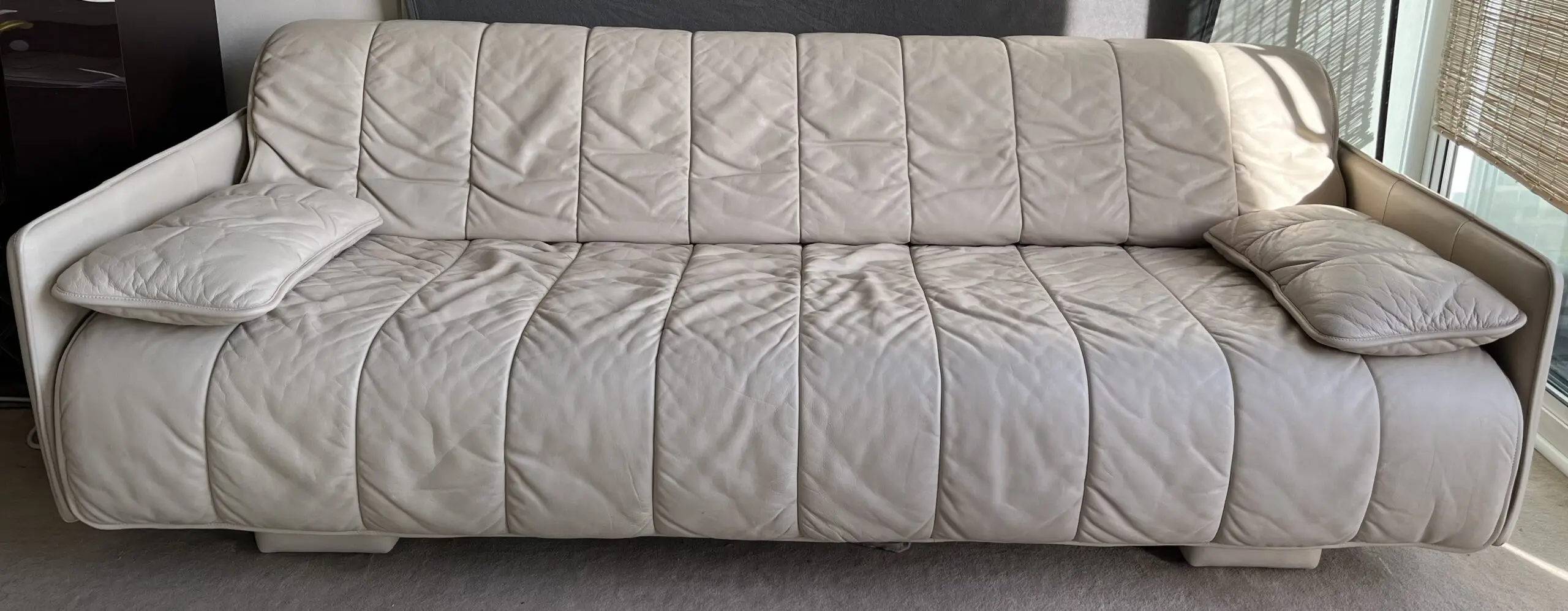 3 seater sofa bed in cream/ivory leather